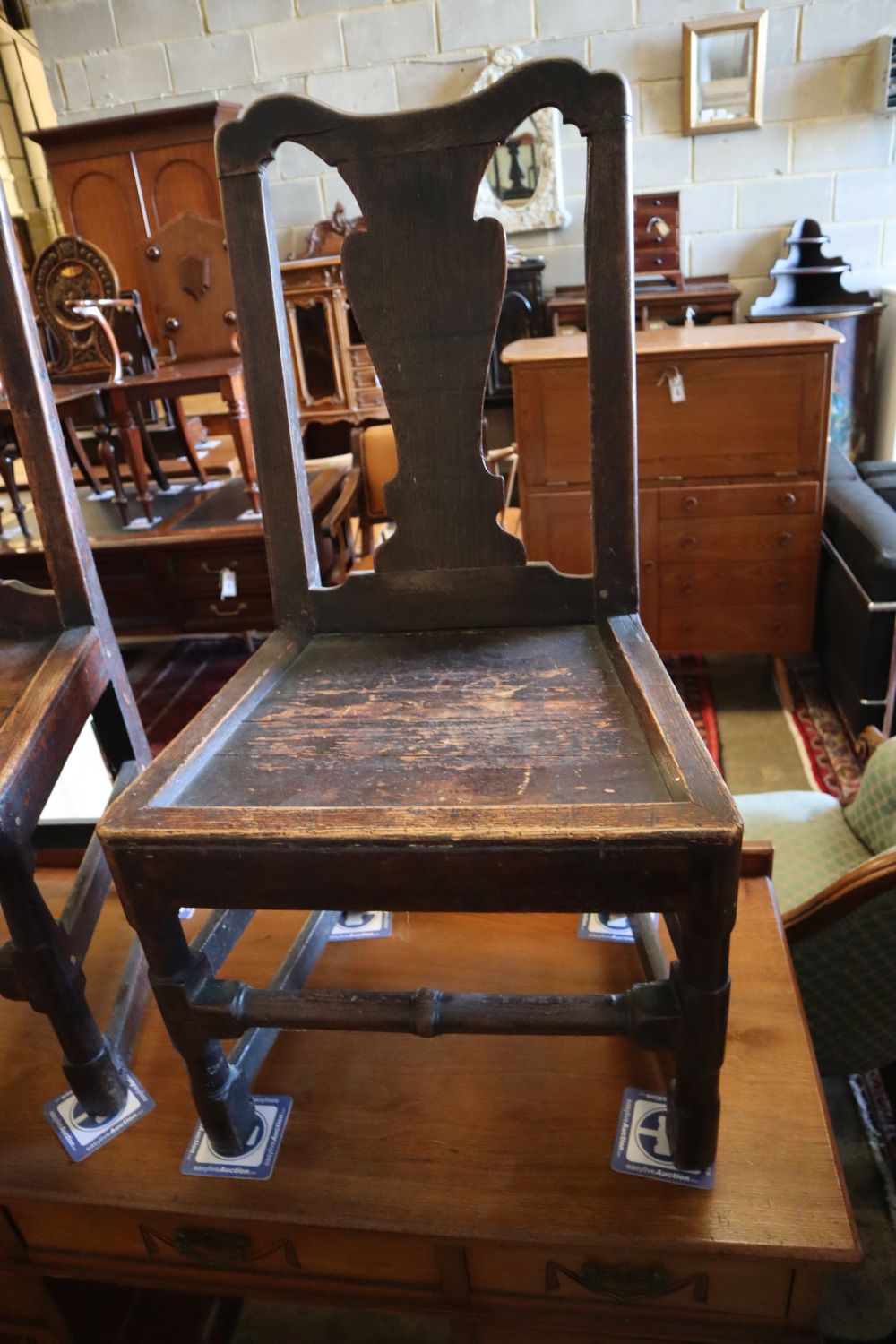A pair of 18th century oak dining chairs